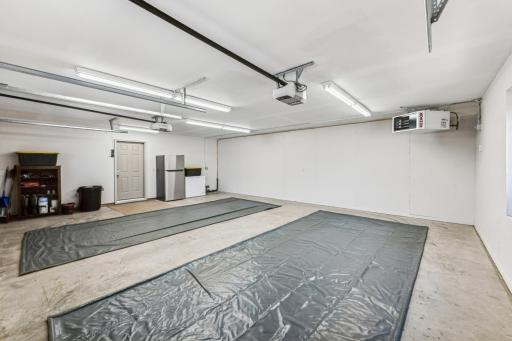 The main floor attached garage is heated and insulated with tons of lighting making your trip in with groceries a much better adventure during the winter months.
