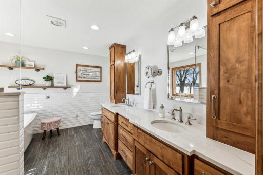 With custom cabinets, granite countertops, dual vanity sinks and lighting, the primary bathroom is definitely sure to impress.