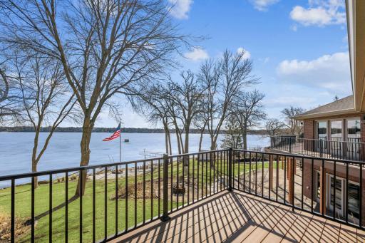 This amazing view is courtesy of the private primary bedroom balcony overlooking Briggs Lake featuring maintenance free decking and railings.