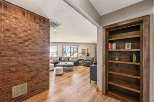 The bookcase shown on the right here is actually a hidden doorway to the tuck under garage and additional storage room.