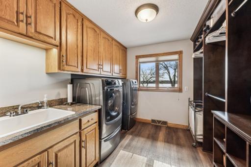 Also renovated was preciously a storage room and is now a gorgeous mud/laundry room right off of the garage entrance fully equipped with a sink and lots of custom cabinets.