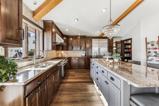 As if there werent enough cabinets, the entire island offers not just a space to congregate, but additional storagea as well.