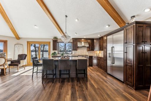Gorgeous kitchen with tons of counter space and storage. The sliding glass door was added in 2021 for ease of access to the deck from the dining room/kitchen.