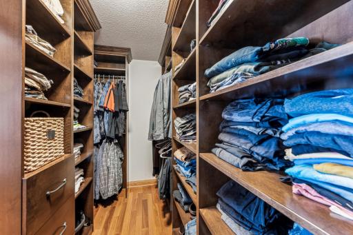 Also featured in the primary bedroom is this massive walk in closet with floor to ceiling custom closet organizer.