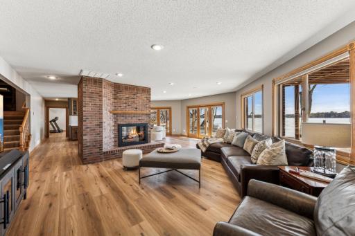 The lower level walk out has no shortage of large picture windows and sliding glass door giving multiple angles and views of the lake.