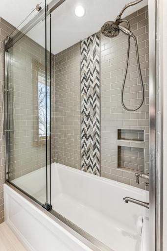 Beautifully done custom tile shower surround in this bathroom.