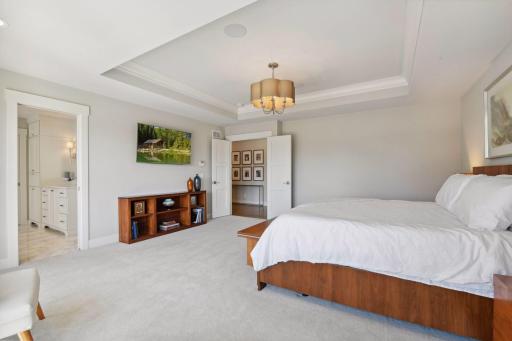 The primary bedroom is luxurious with a spa-like ensuite.