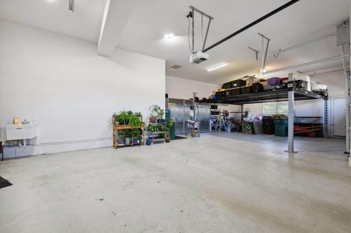 The garage has four deep stalls and high ceilings.