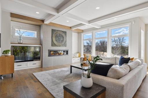 Natural light floods the warm and inviting living room.