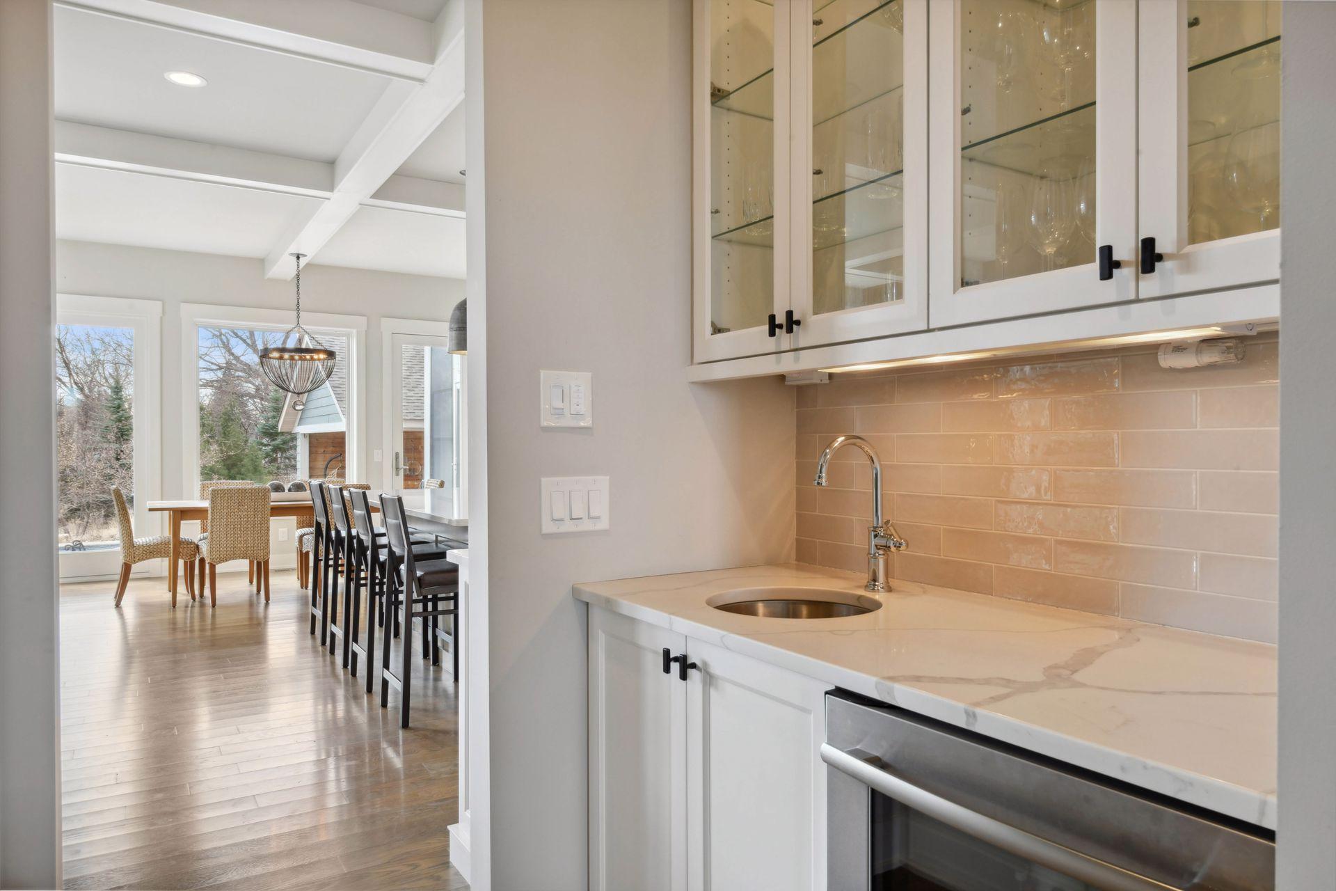 Butler's pantry complete with sink and beverage refrigerator.