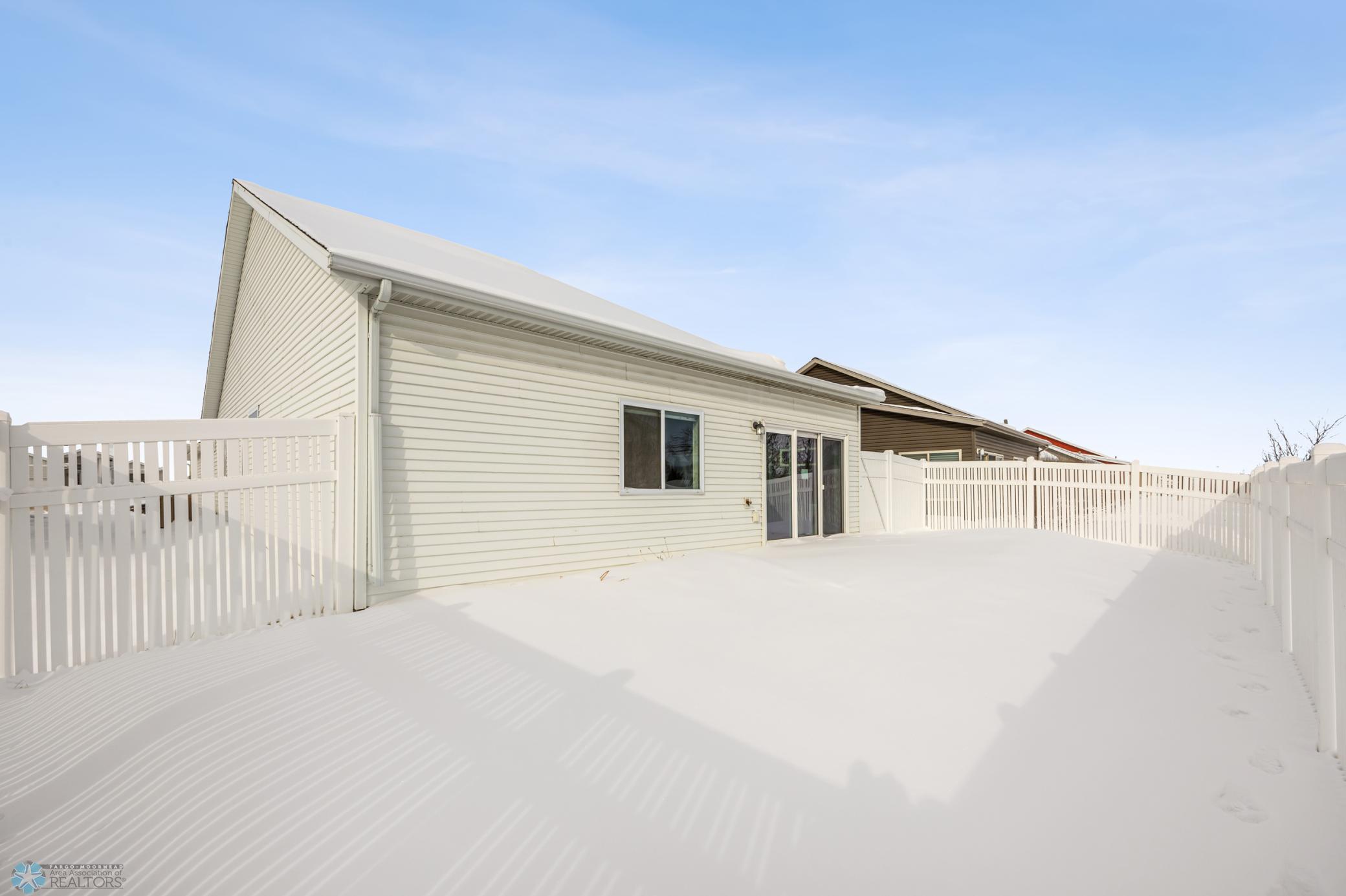 BENEATH THE SNOW there's a concrete patio and TURF!
