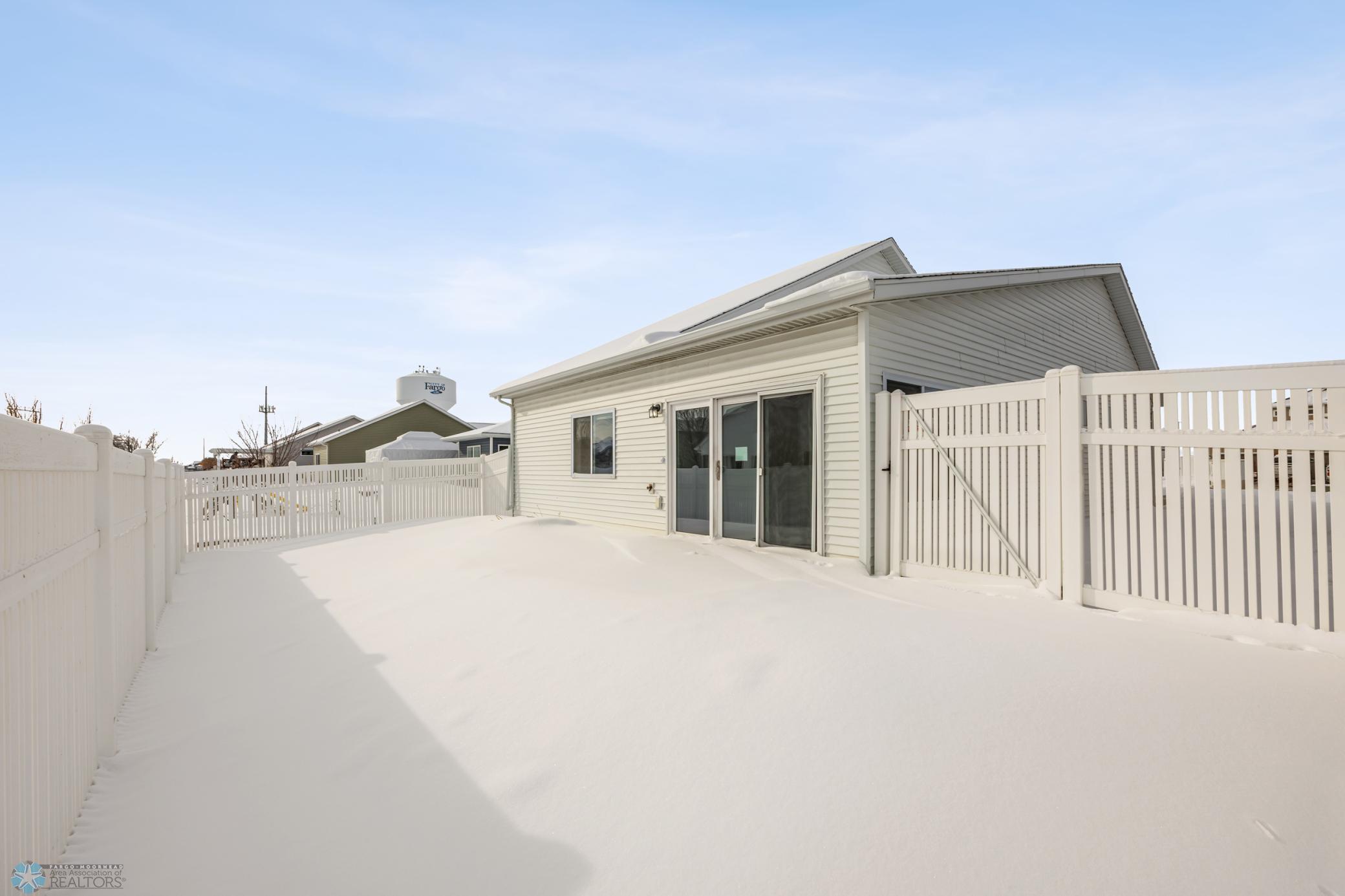 BENEATH THE SNOW there's a concrete patio and TURF!