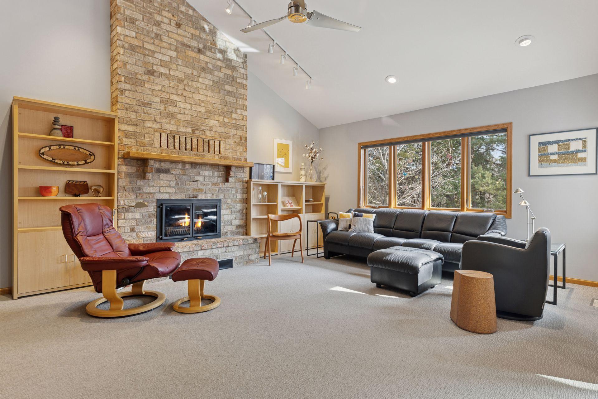 This stunning family room is anchored by a beautiful wood burning fireplace with a heatilator insert, enhancing its efficiency.