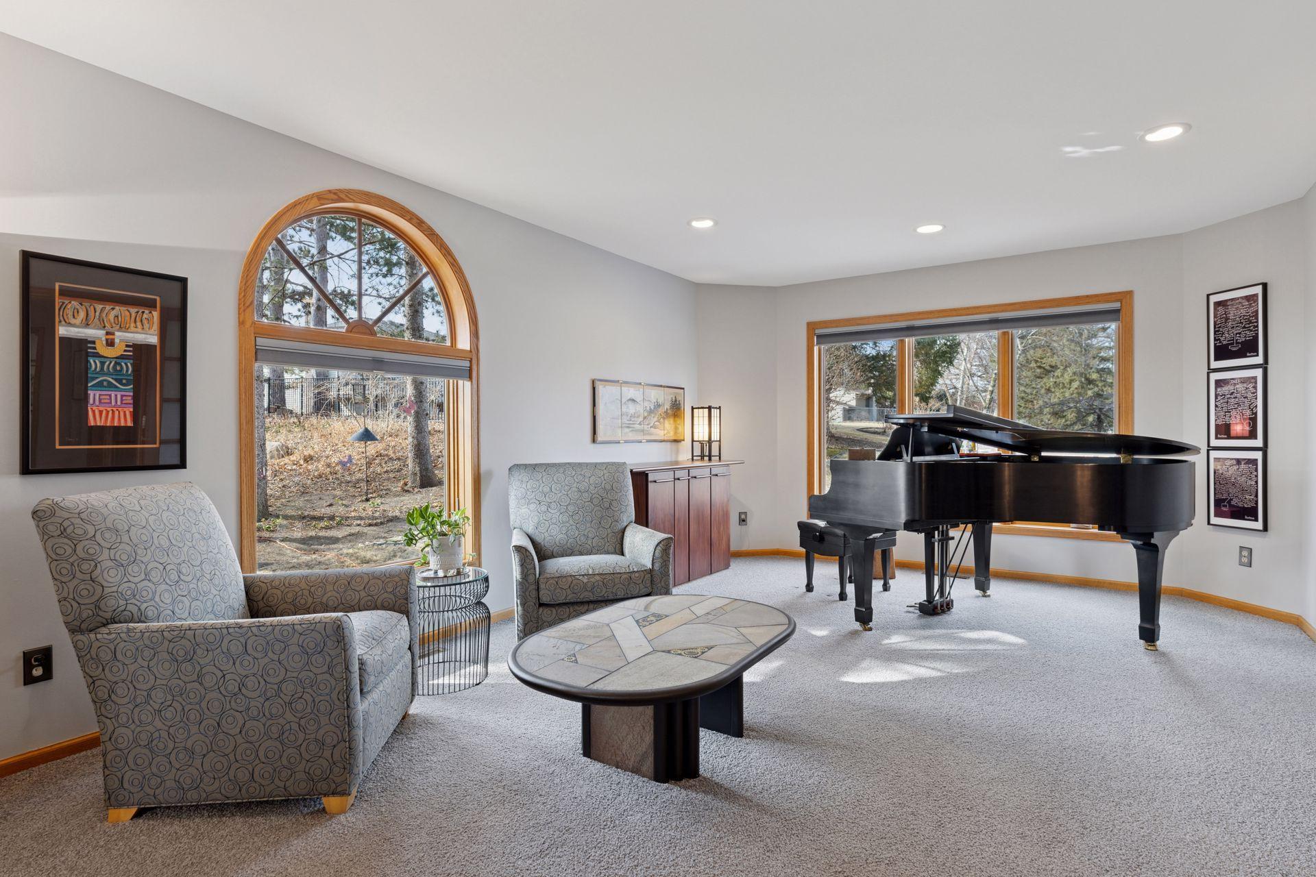 Upgraded Marvin windows fill the home with natural light, framing views of the beautifully landscaped yard and private outdoor spaces.