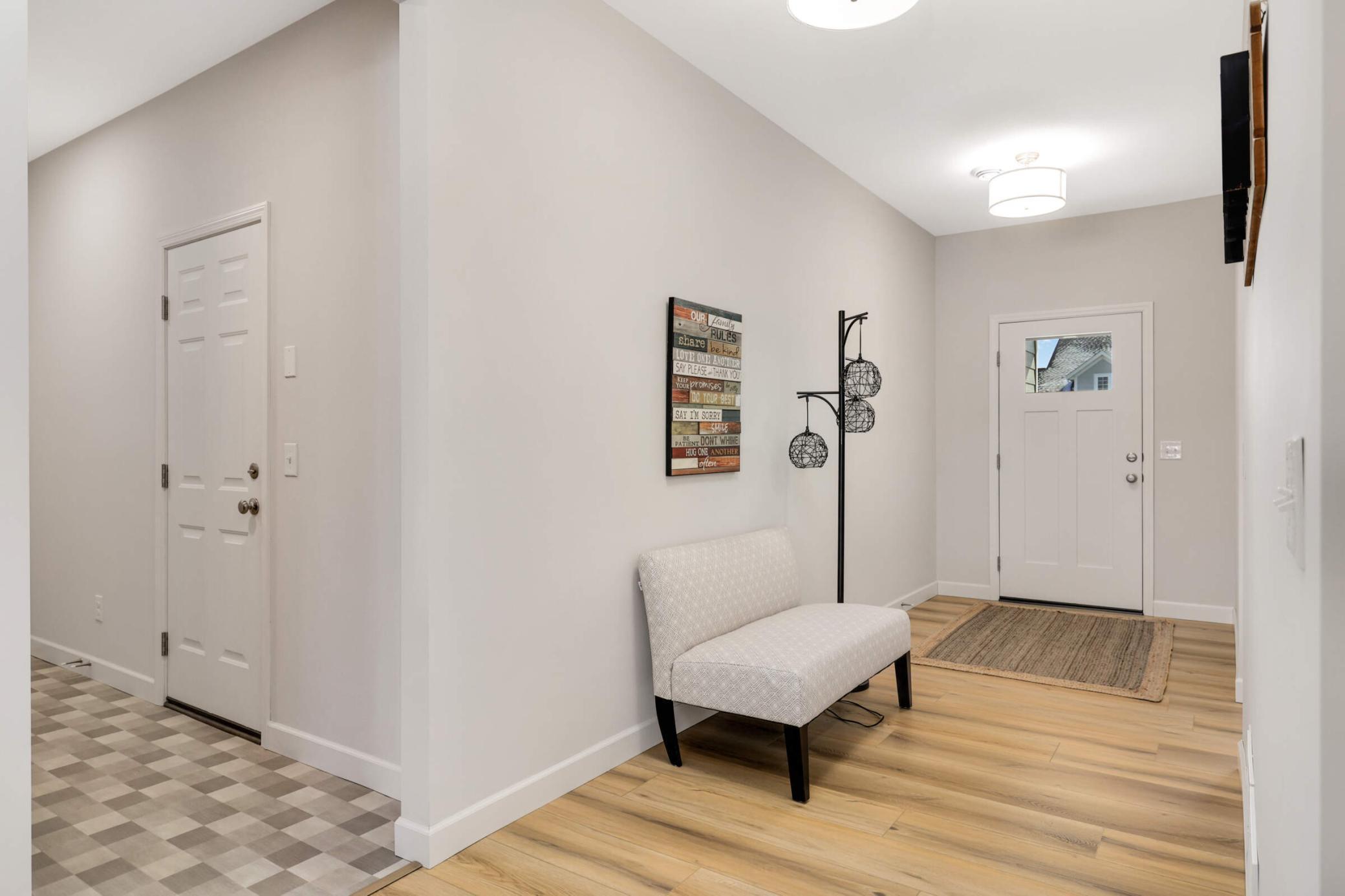 Wide, open entry at the front door and garage access