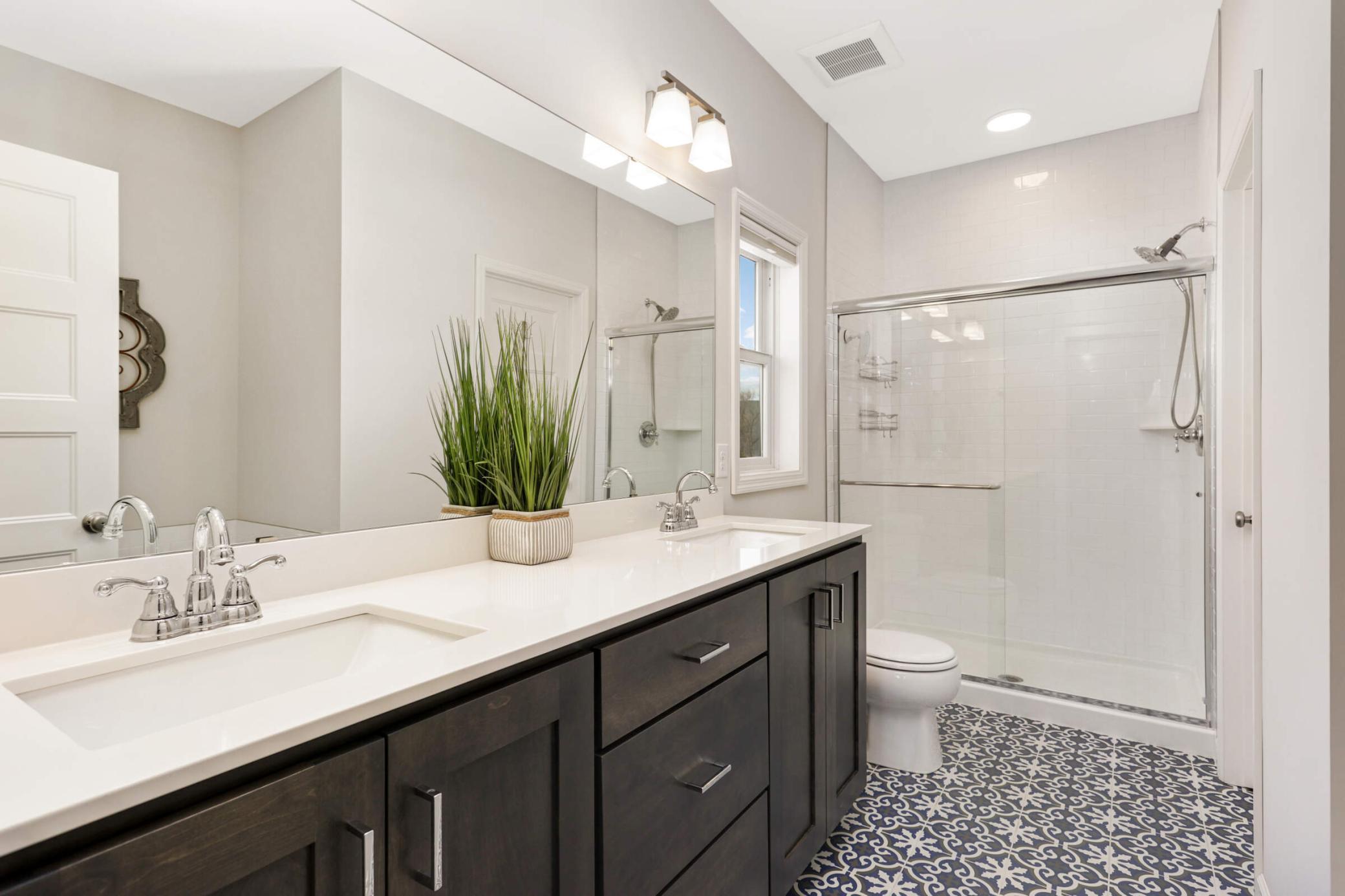 Owner’s bath is a true retreat, featuring elegant finishes and plenty of space
