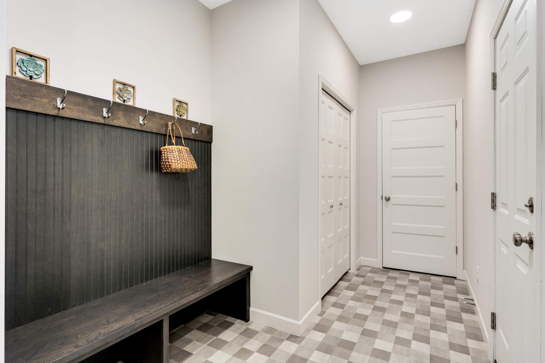 Thoughtfully designed drop zone offers a practical space for coats, bags, and shoes