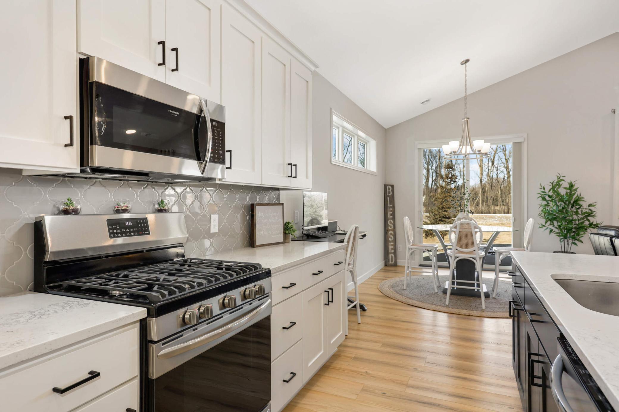 Kitchen features a beautiful backsplash that adds a touch of elegance and character