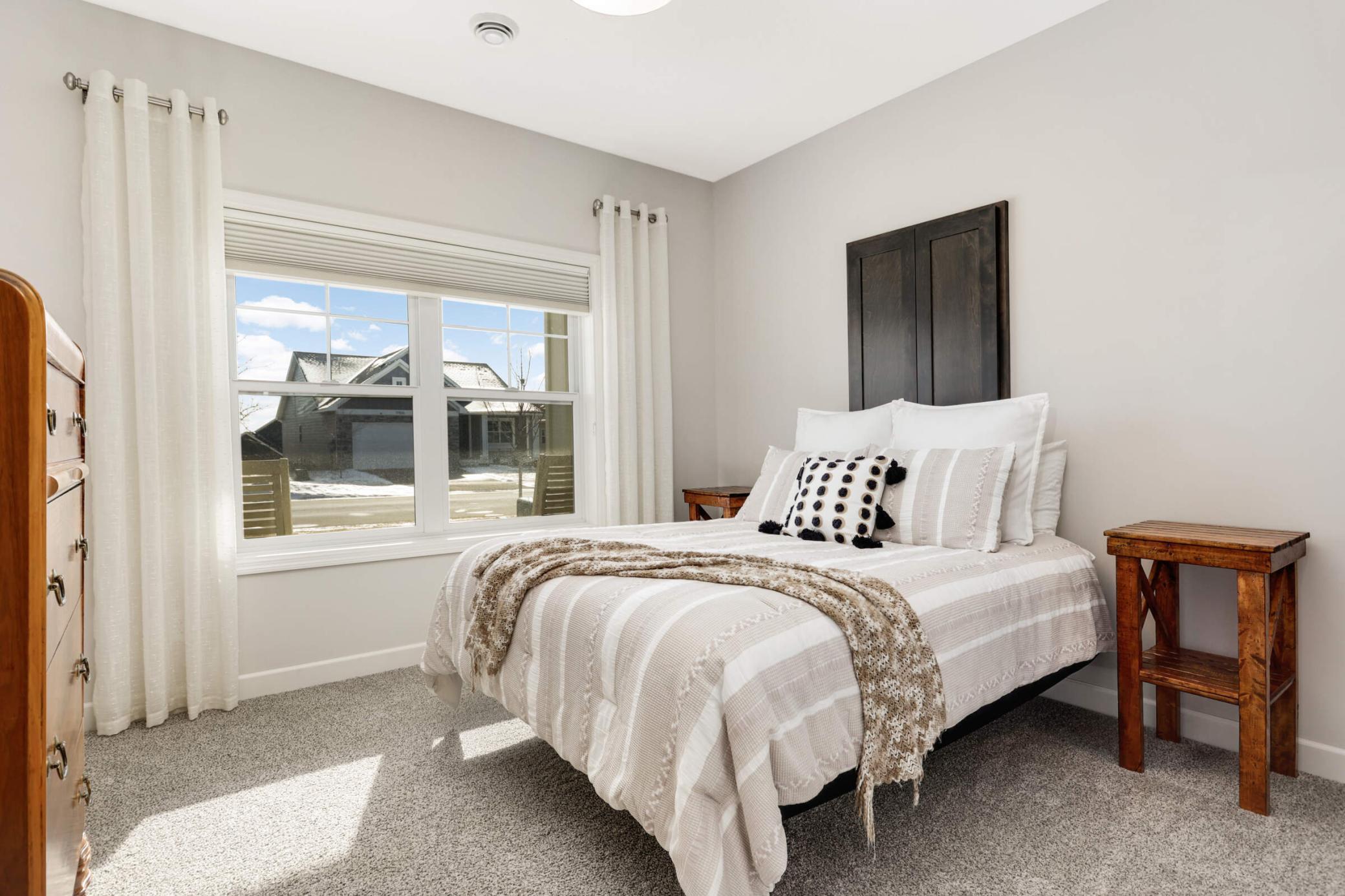 This inviting second bedroom is perfect for guests, a home office, or a child’s room
