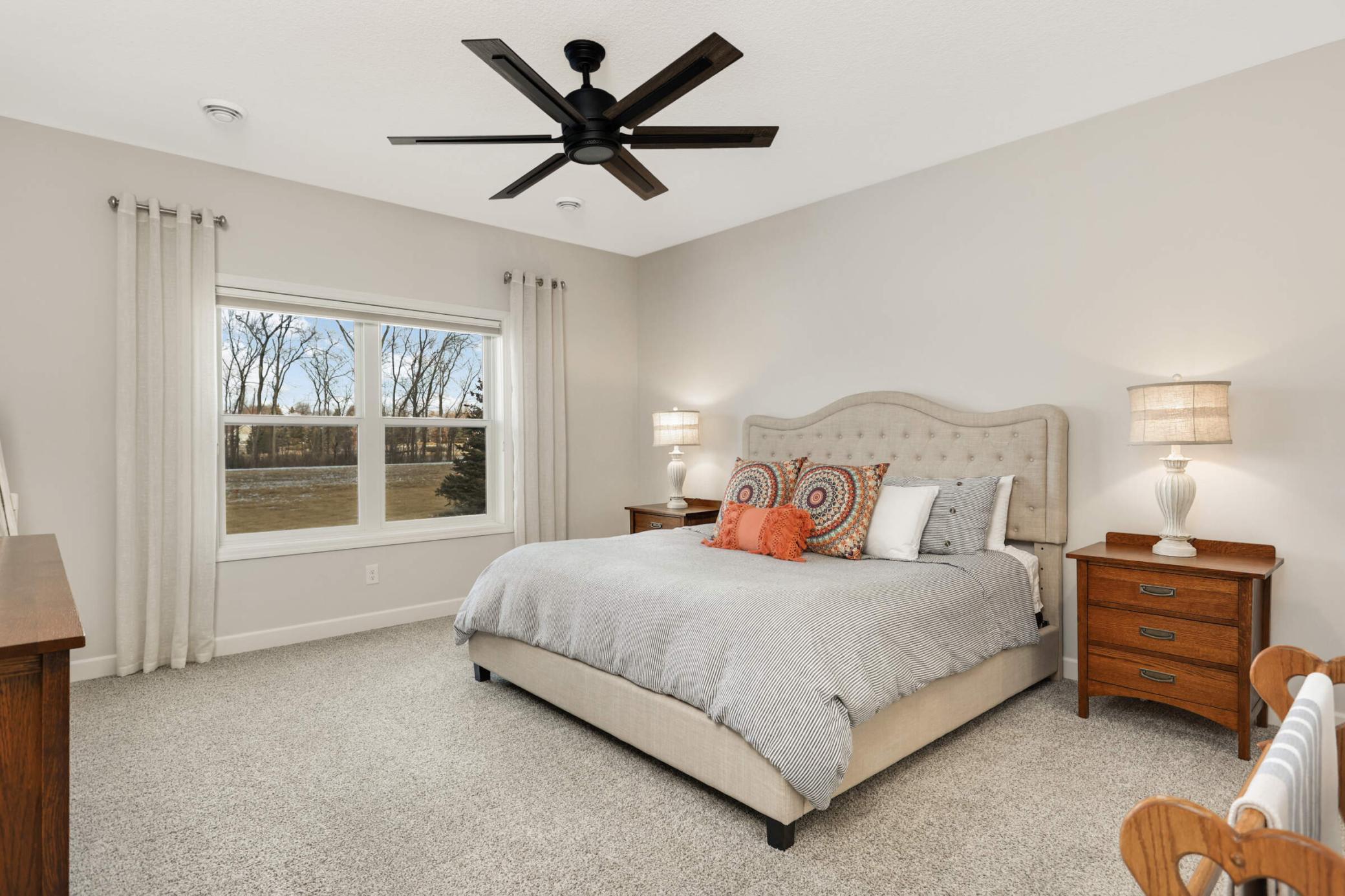 Large owner’s bedroom offers a peaceful retreat with ample space for relaxation