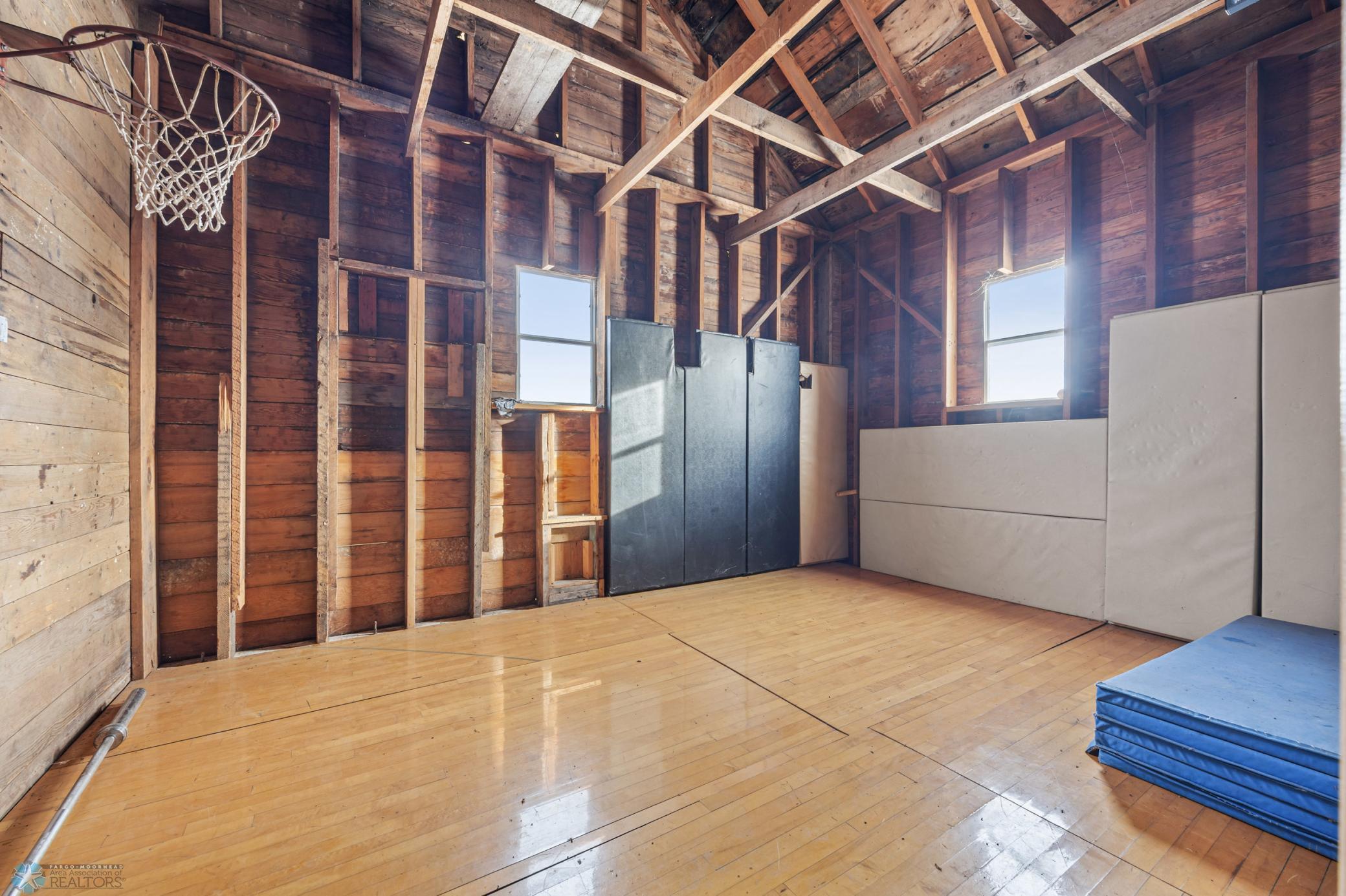 "Playhouse" - 32x24 (A), with "turf" carpet, rock climbing wall, and sport court!