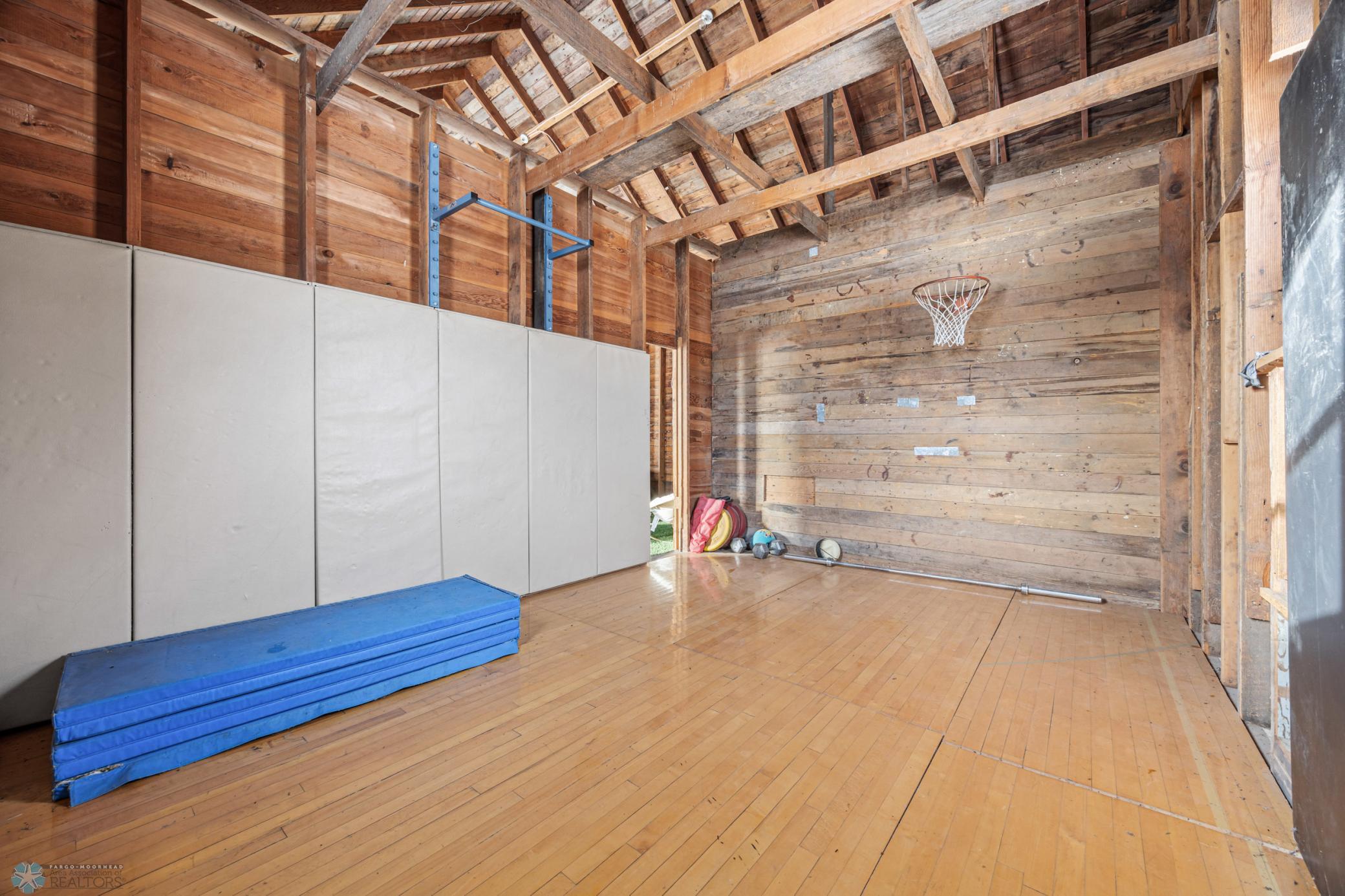 "Playhouse" - 32x24 (A), with "turf" carpet, rock climbing wall, and sport court!
