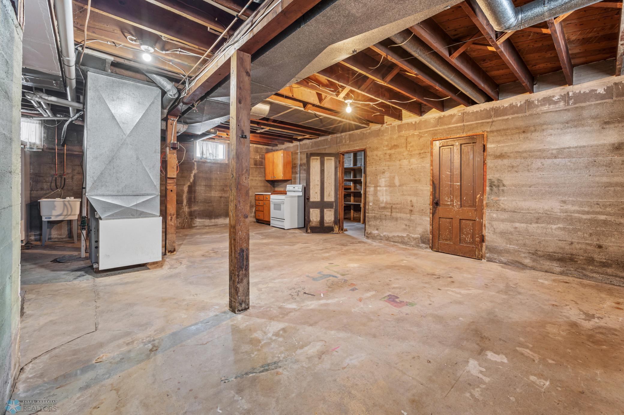 Clean and tall basement, unfinished, updated forced air heat & central air conditioning.