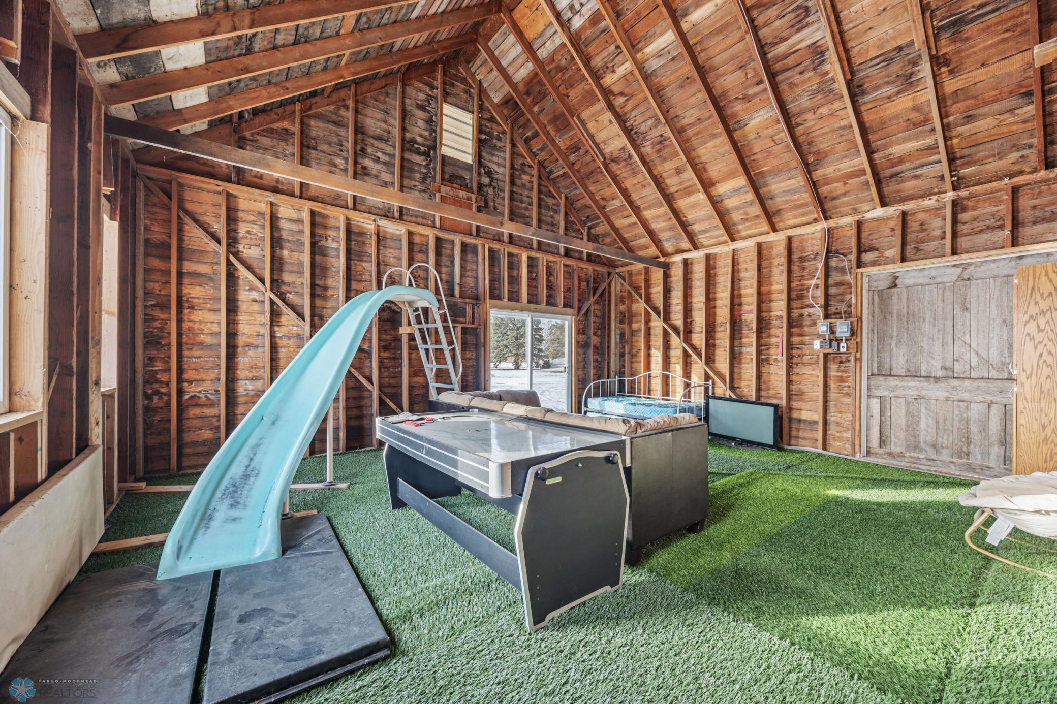 "Playhouse" - 32x24 (A), with "turf" carpet, rock climbing wall, and sport court!