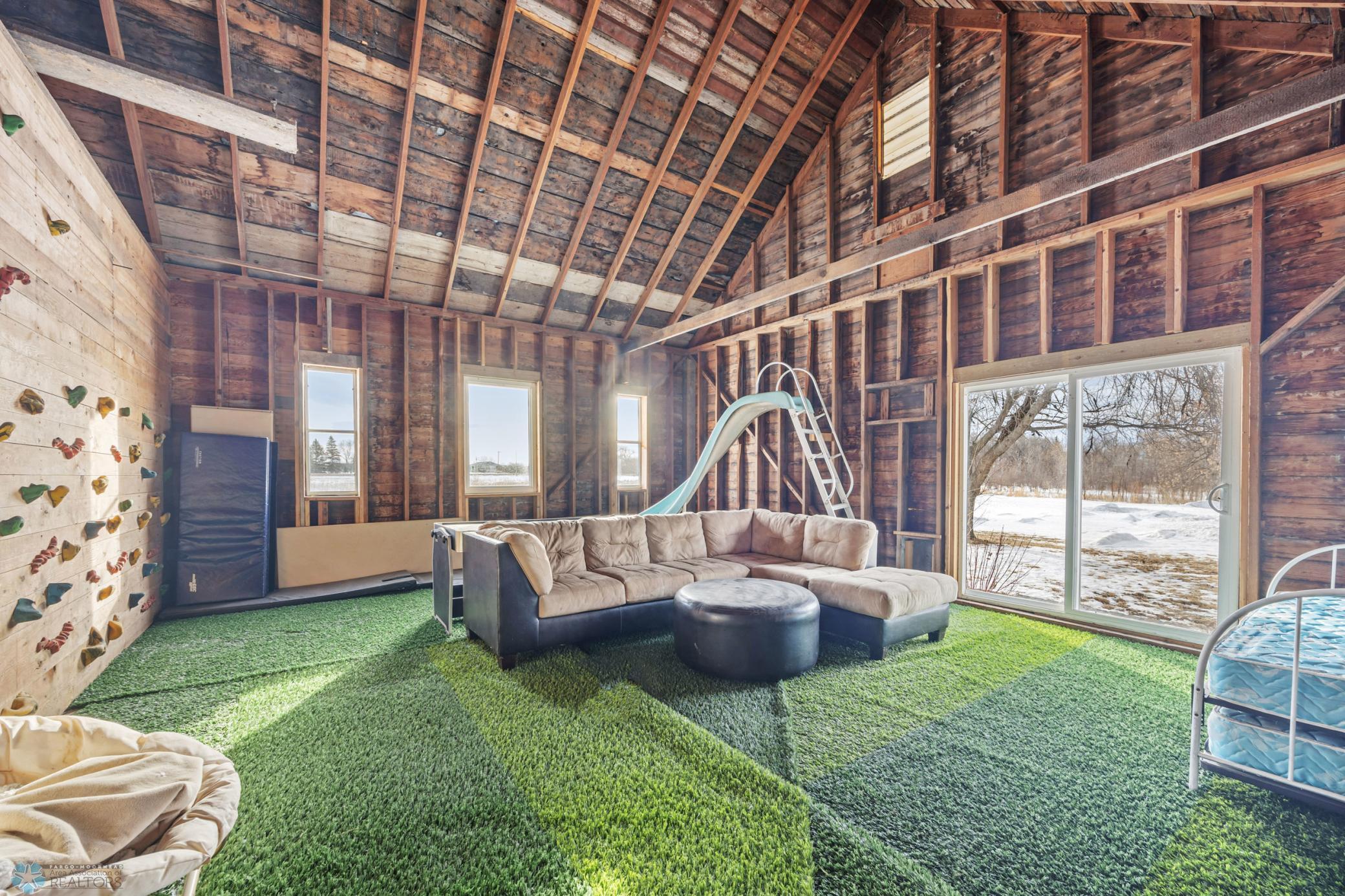 "Playhouse" - 32x24 (A), with "turf" carpet, rock climbing wall, and sport court!
