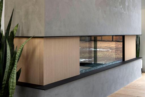 Fireplace is wrapped in a Roman clay finish