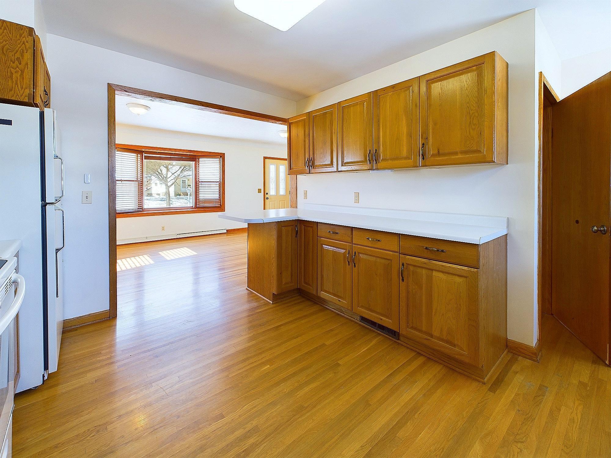 View through the kitchen to the front bay window.