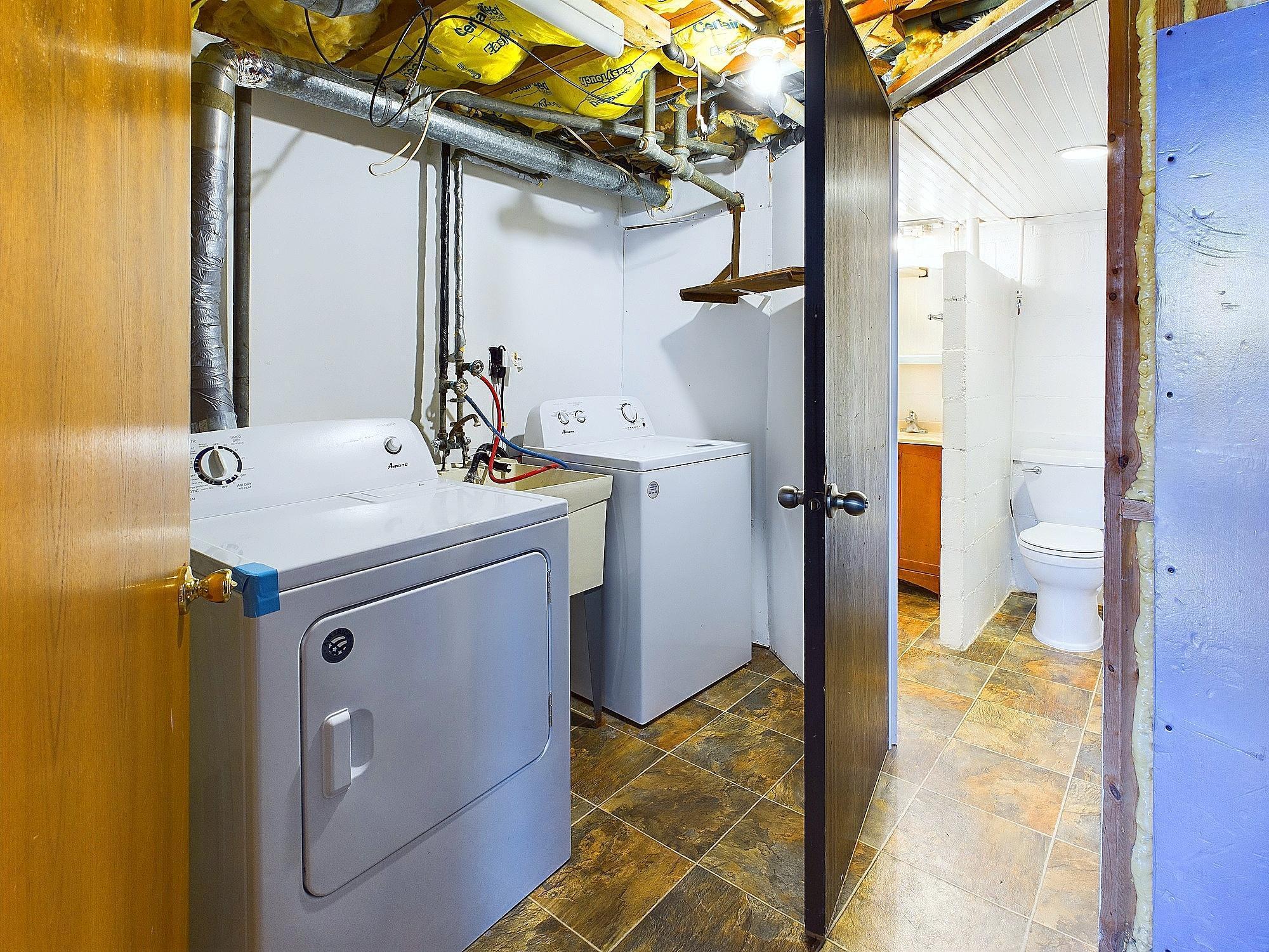 Through the shared laundry to the other living space. Both the doors lock.