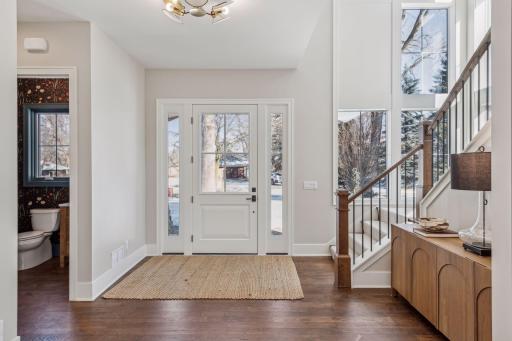 Foyer with the corner windows around staircase allow floods of natural light