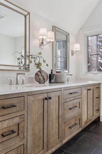 Quarter-sewn oak custom cabinetry in primary suite bath
