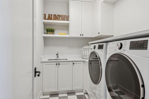 Laundry room conveniently located on upper level
