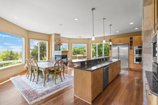 Gourmet chefâs kitchen with high-end appliances, open to living and dining spacesâideal for entertaining.
