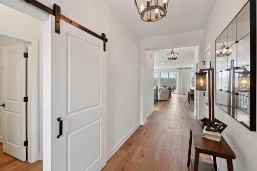 Welcoming front entry with a barn door offering privacy to your guest suite