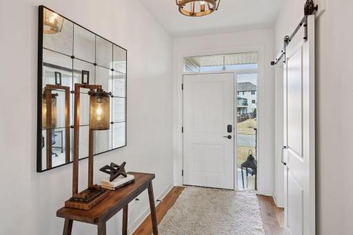The front foyer of the home has direct access to the office, a bathroom and the second main floor bedroom