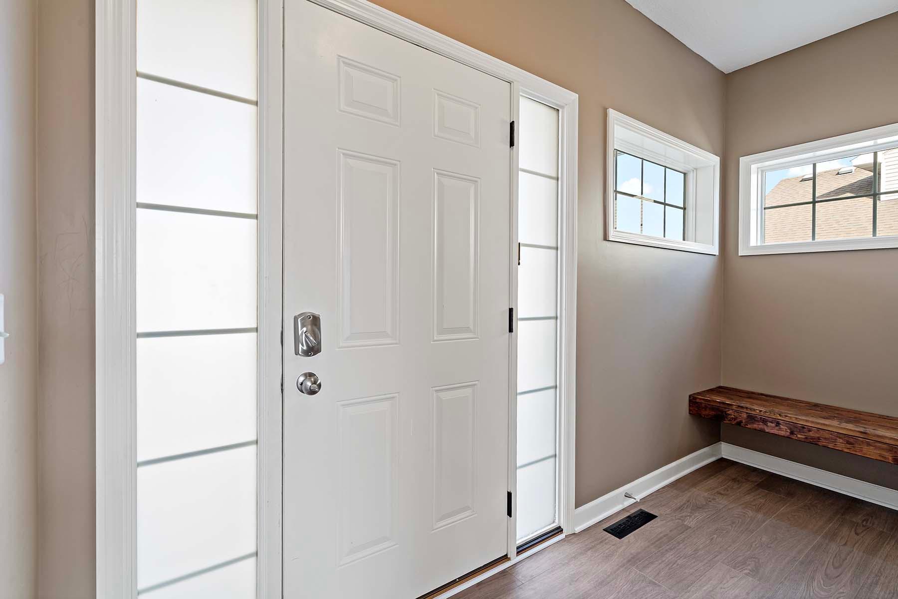 Entry way with bench perfect for sitting to put on shoes!