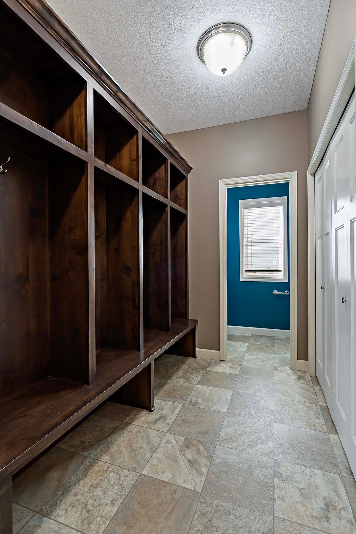 Mudroom off of garage. Powder bath is straight ahead, kitchen is to the left.
