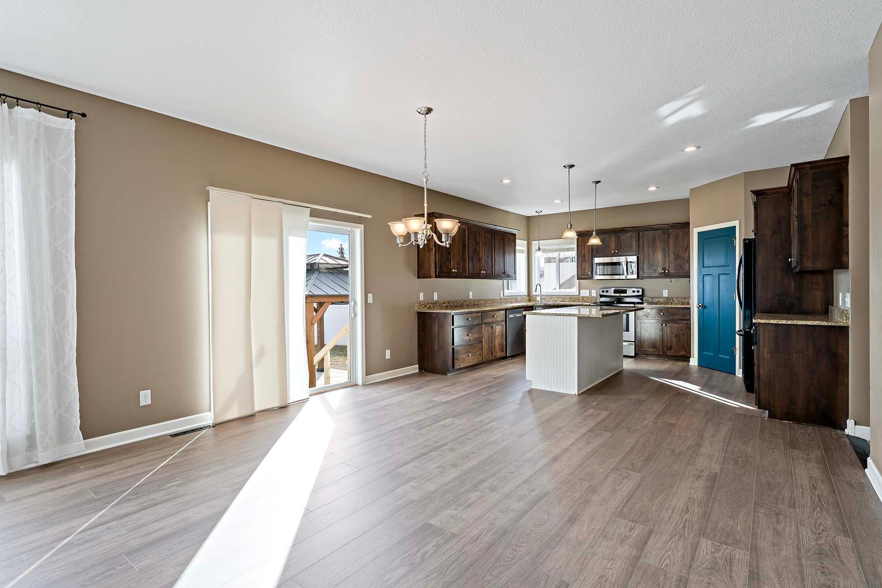 Dining room and kitchen with slider to fully fenced back yard