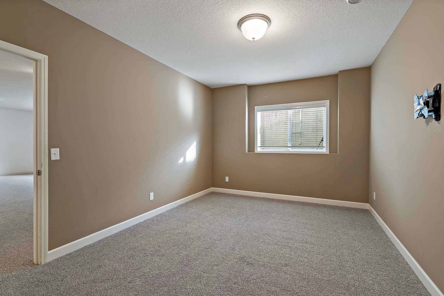 Lower level bedroom off of family room and next to bathroom