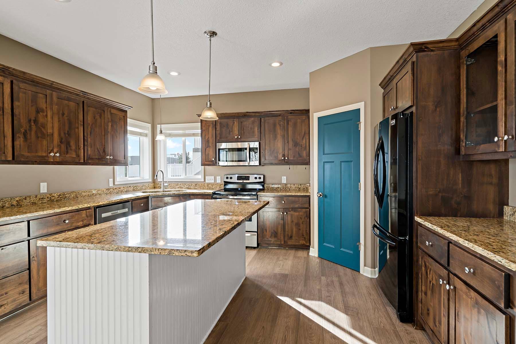 Kitchen with large island and walk in pantry!
