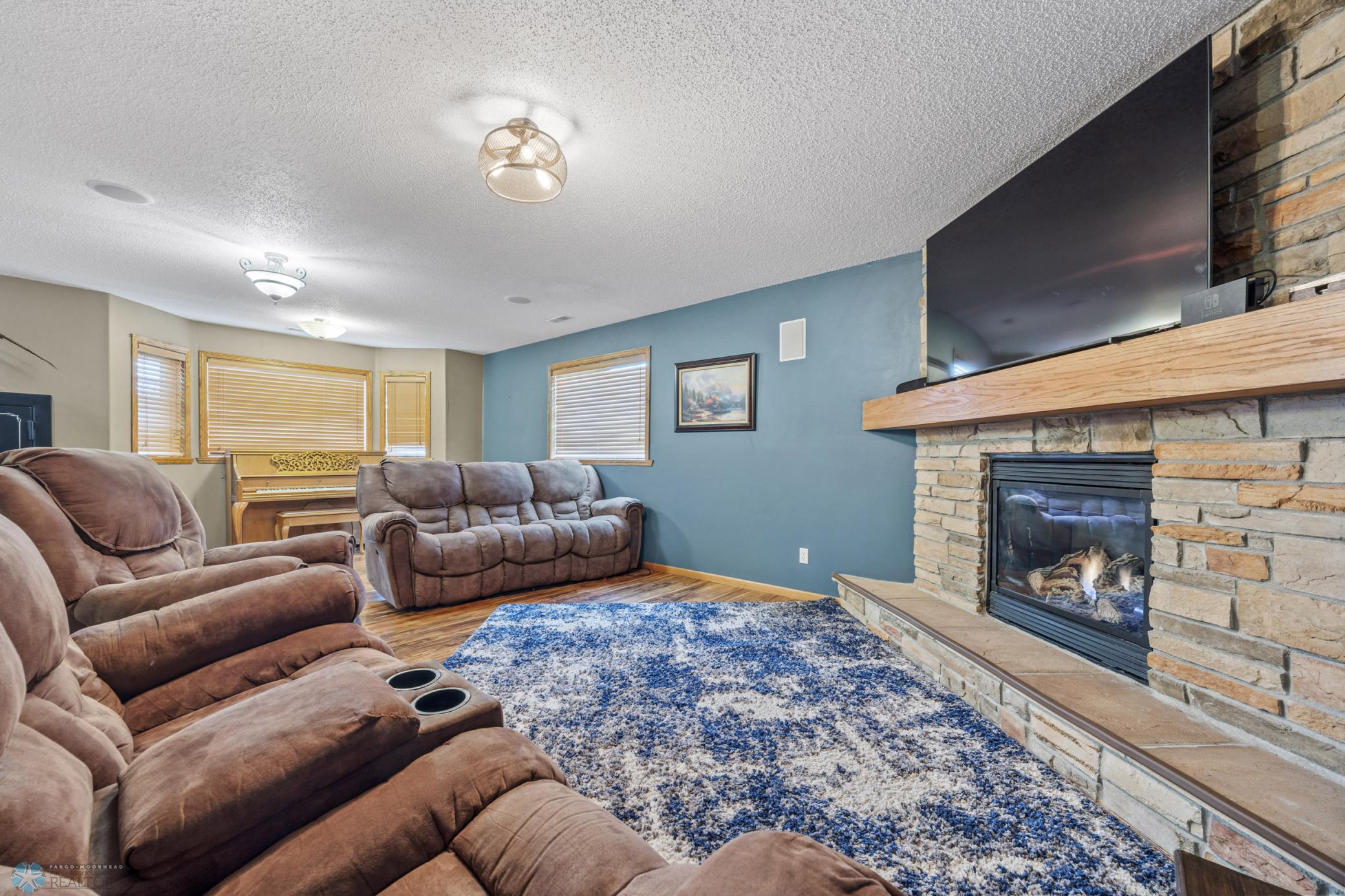 Lower Level Family room w/ stone gas fireplace