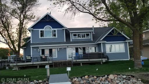 The large lake side deck is great for gatherings at the lake ample seating and quick access to the lake. Great lake side green space for outdoor games.