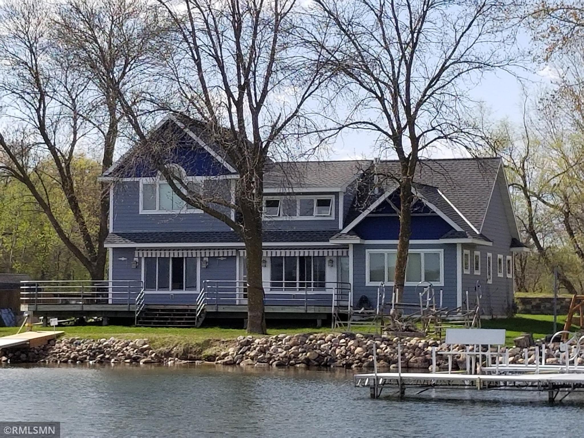 On the shores of Sugar lakes sits this premier lake home with 85 feet of ideal elevation. The attention to detail and design on the interior and how it compliments the lot was well thought out.