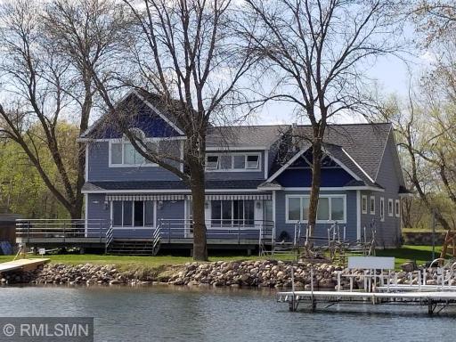 On the shores of Sugar lakes sits this premier lake home with 85 feet of ideal elevation. The attention to detail and design on the interior and how it compliments the lot was well thought out.