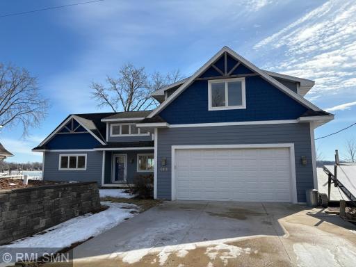 Property has a 2 car attached garage, concrete driveway and hardi board siding.