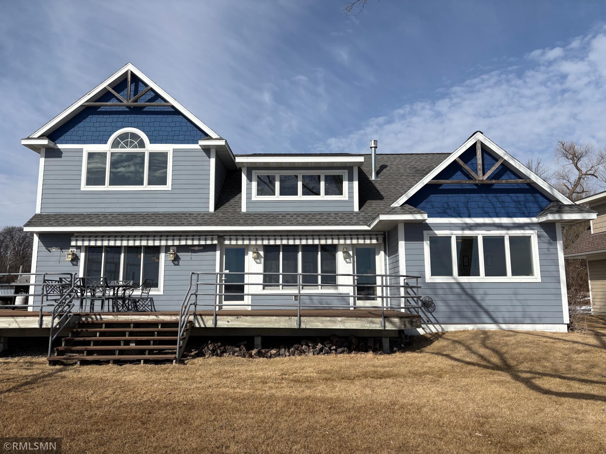The natural light flows throughout the home with all the lakeside glass. Allows the sunshine in and views of Sugar Lake from the inside all day. How a lake home should be designed.