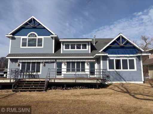 The natural light flows throughout the home with all the lakeside glass. Allows the sunshine in and views of Sugar Lake from the inside all day. How a lake home should be designed.